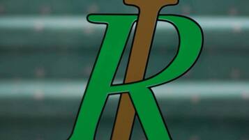 A stylized letter 'R' with a crown on top, set against a blurred background of horizontal lines.