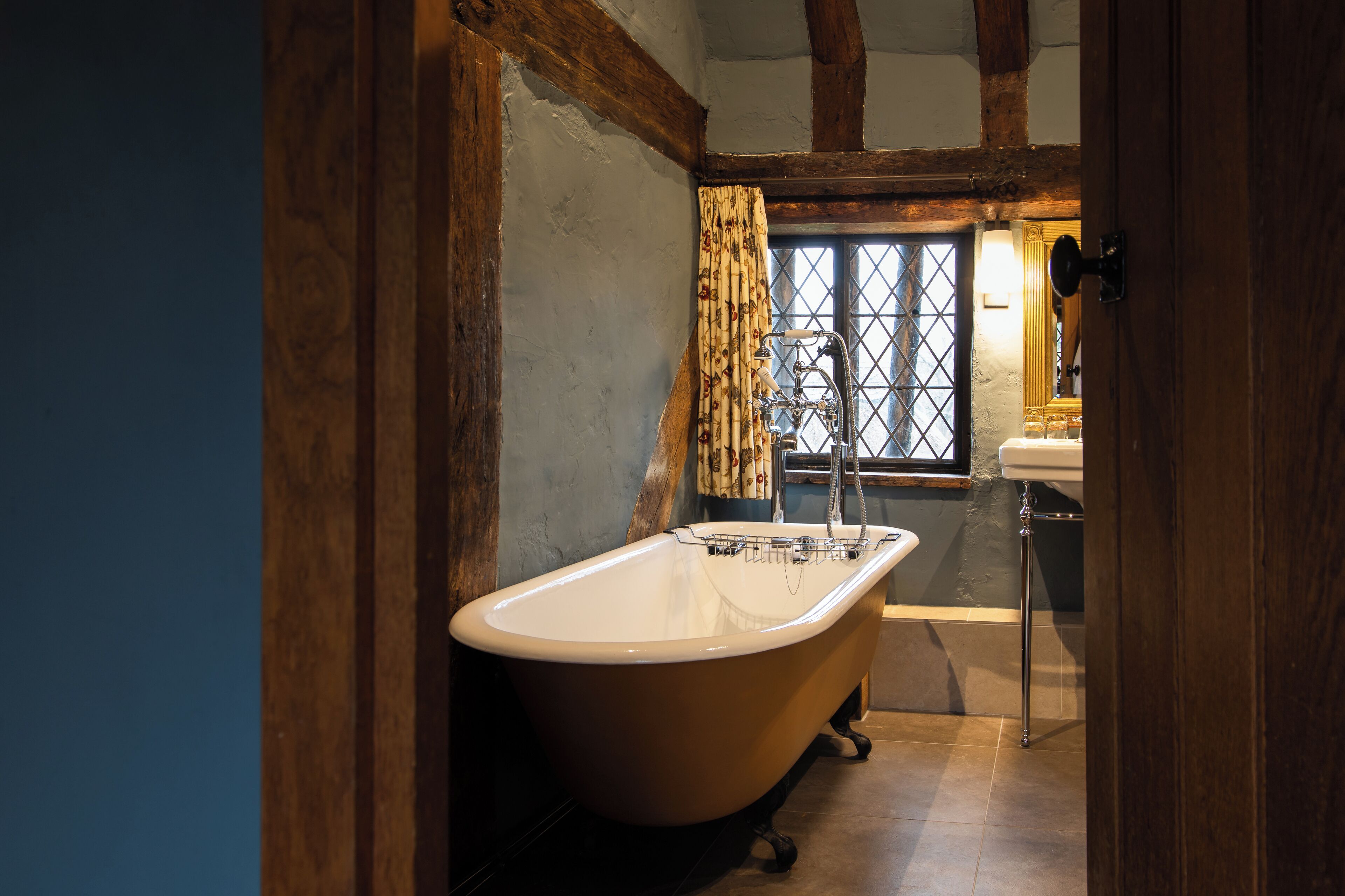 feature four poster room | bathroom | combined shower/bathtub, designer toiletries, hair dryer, bathrobes