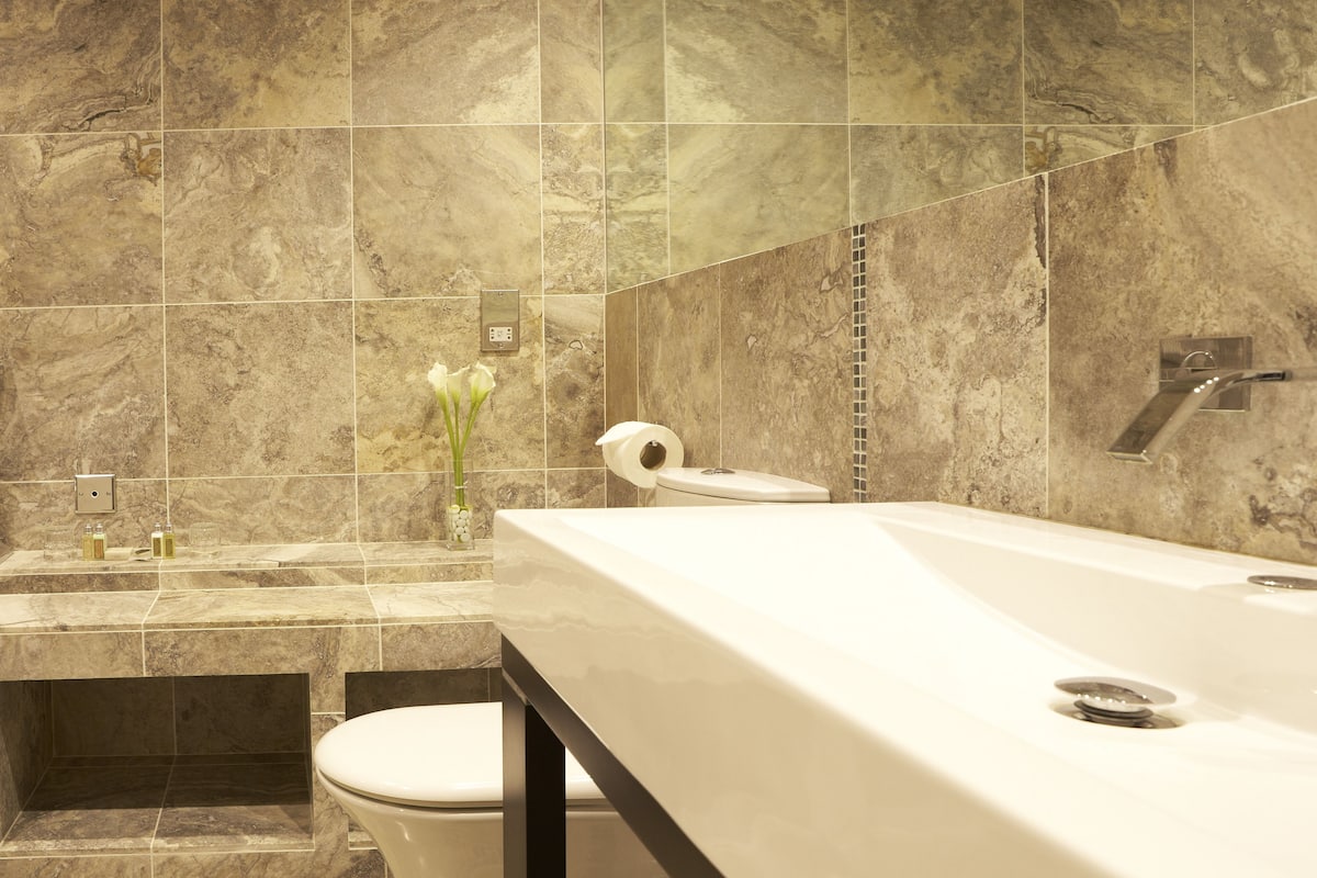 deluxe double room | bathroom | designer toiletries, hair dryer, towels