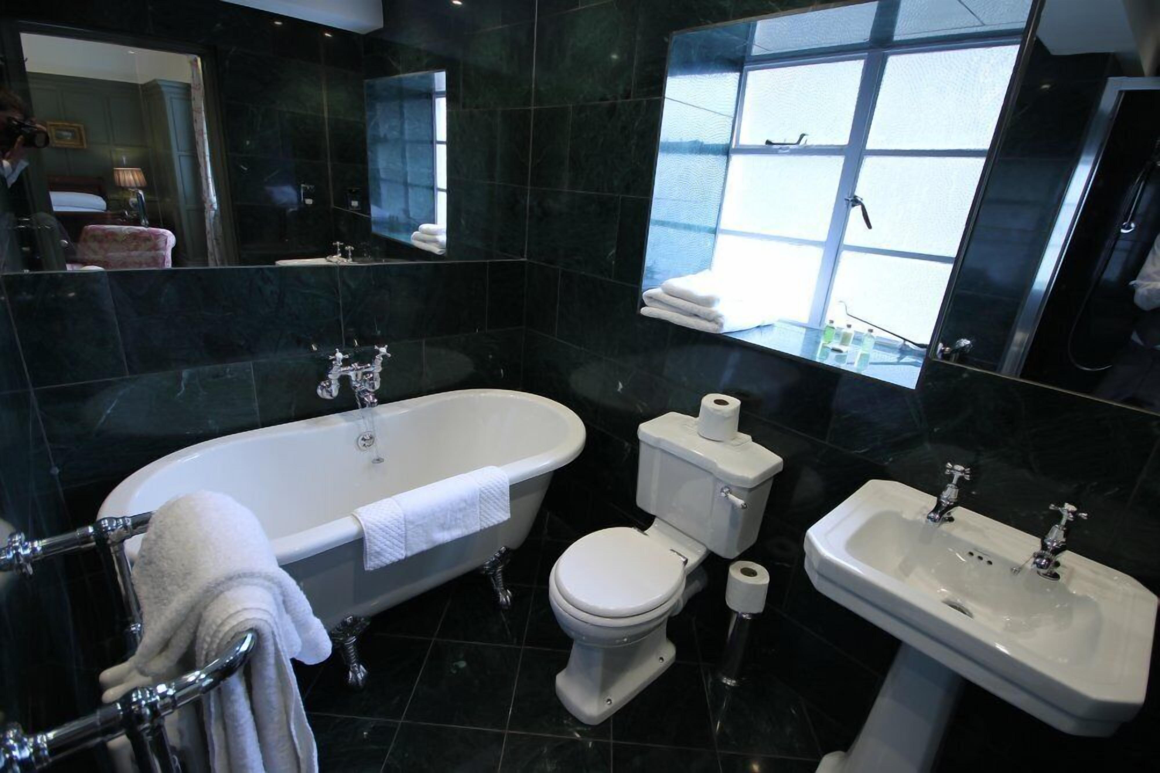 deluxe double room | bathroom | designer toiletries, hair dryer, towels