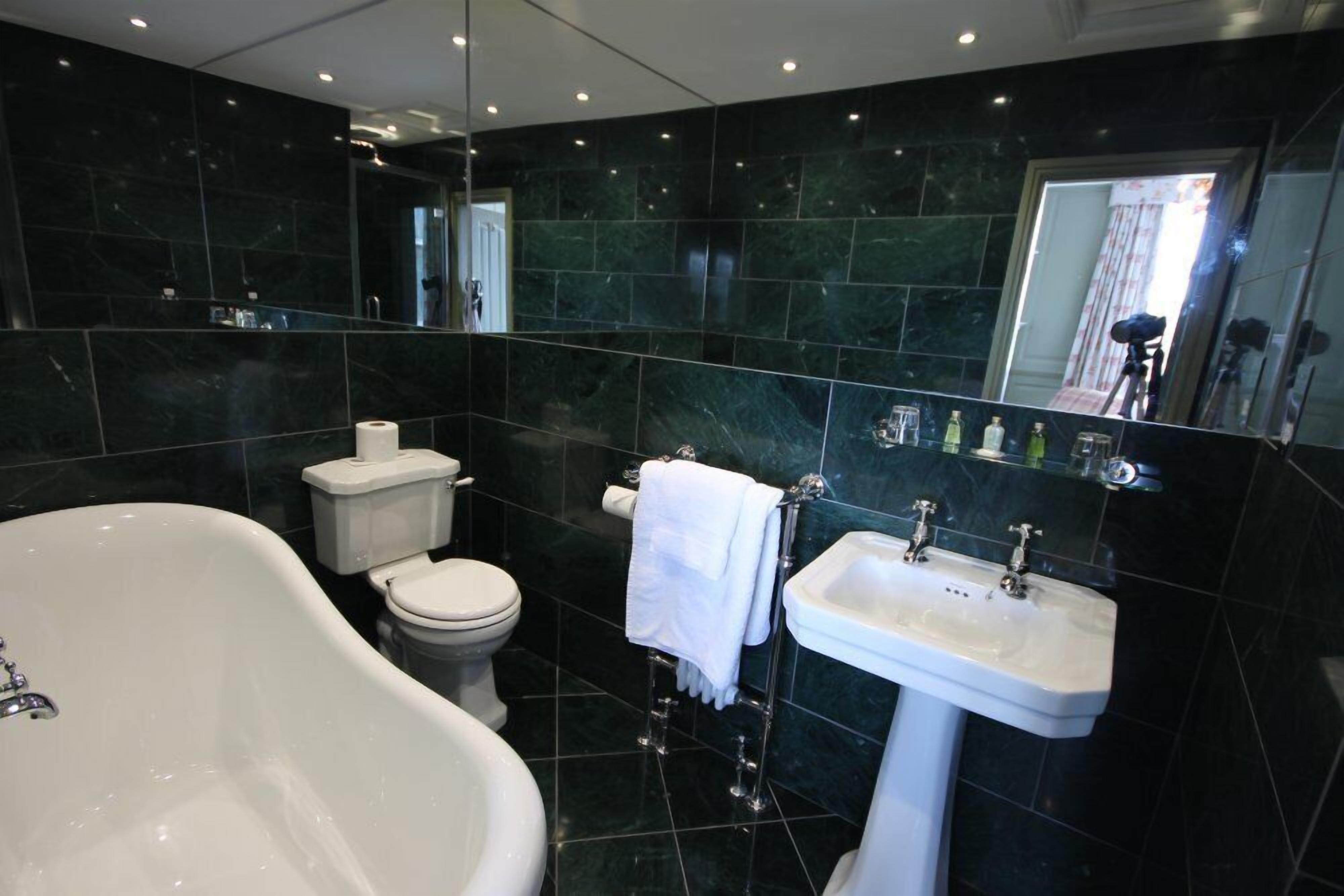 deluxe double room | bathroom | designer toiletries, hair dryer, towels