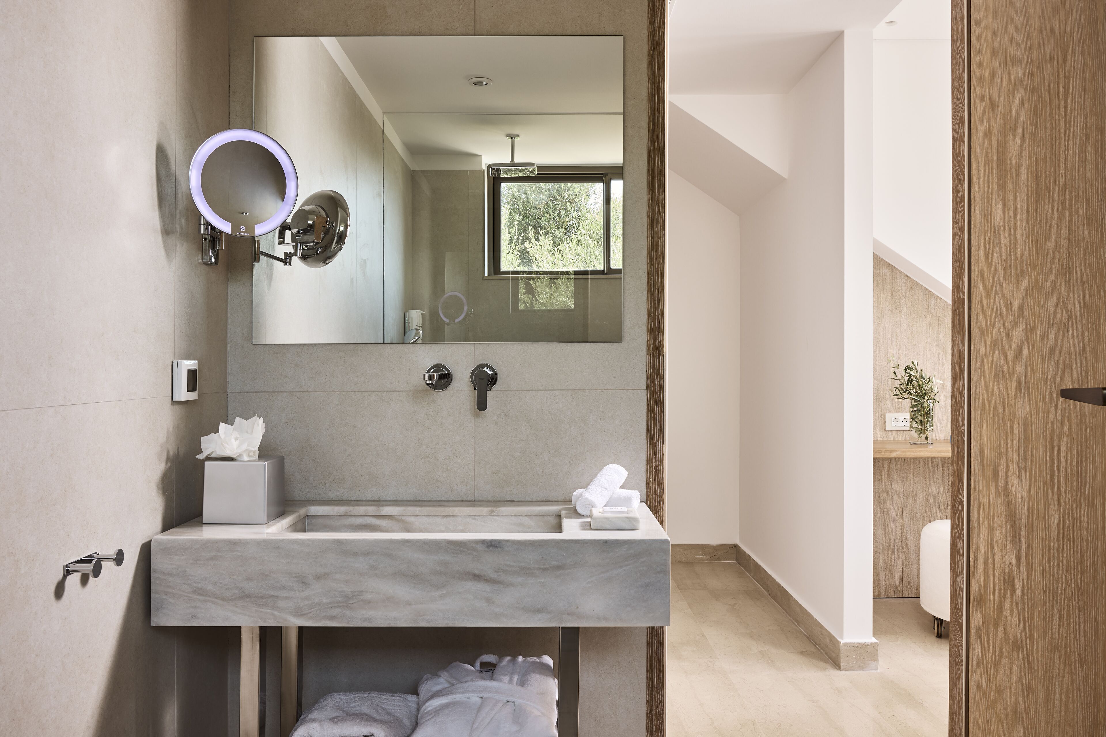 combined shower/bathtub, designer toiletries, hair dryer, bathrobes