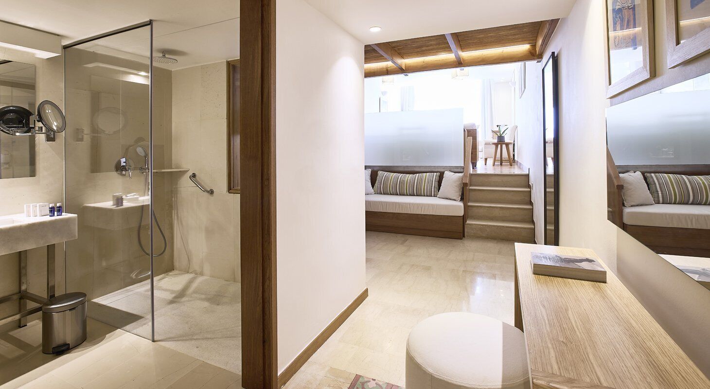 club suite, private pool (mezzanine  seafront) | bathroom | combined shower/bathtub, designer toiletries, hair dryer, bathrobes