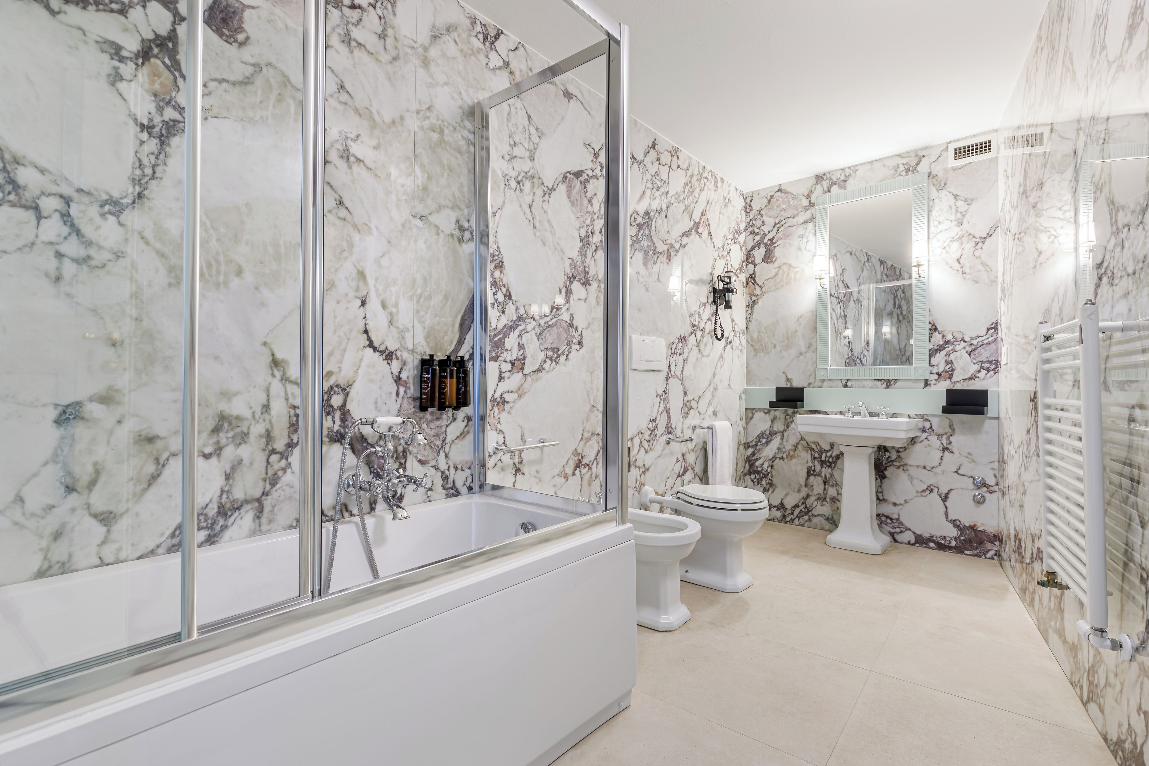 deluxe double room | bathroom | eco-friendly toiletries, hair dryer, bidet, towels