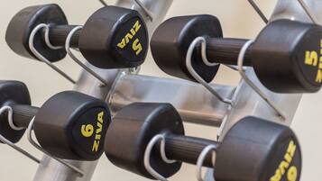 A rack of dumbbells with weights ranging from 1 to 9.