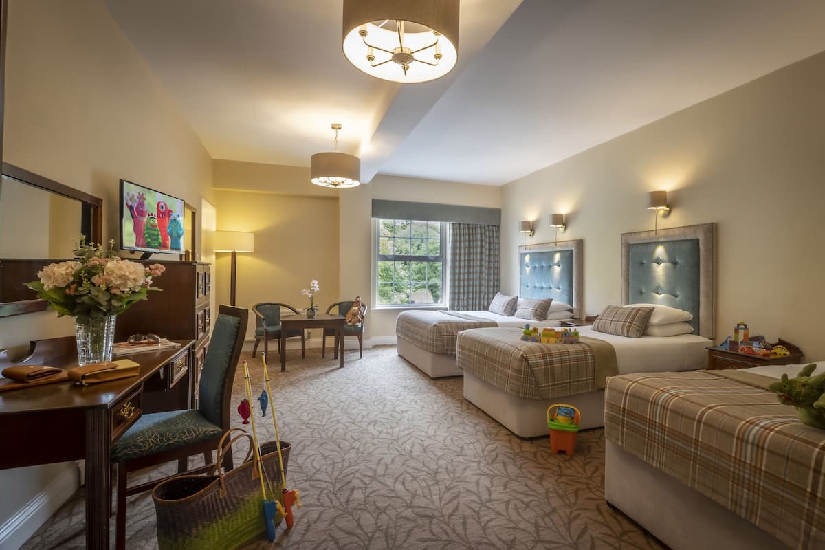 Family Room, Multiple Beds | In-room safe, desk, iron/ironing board, free WiFi