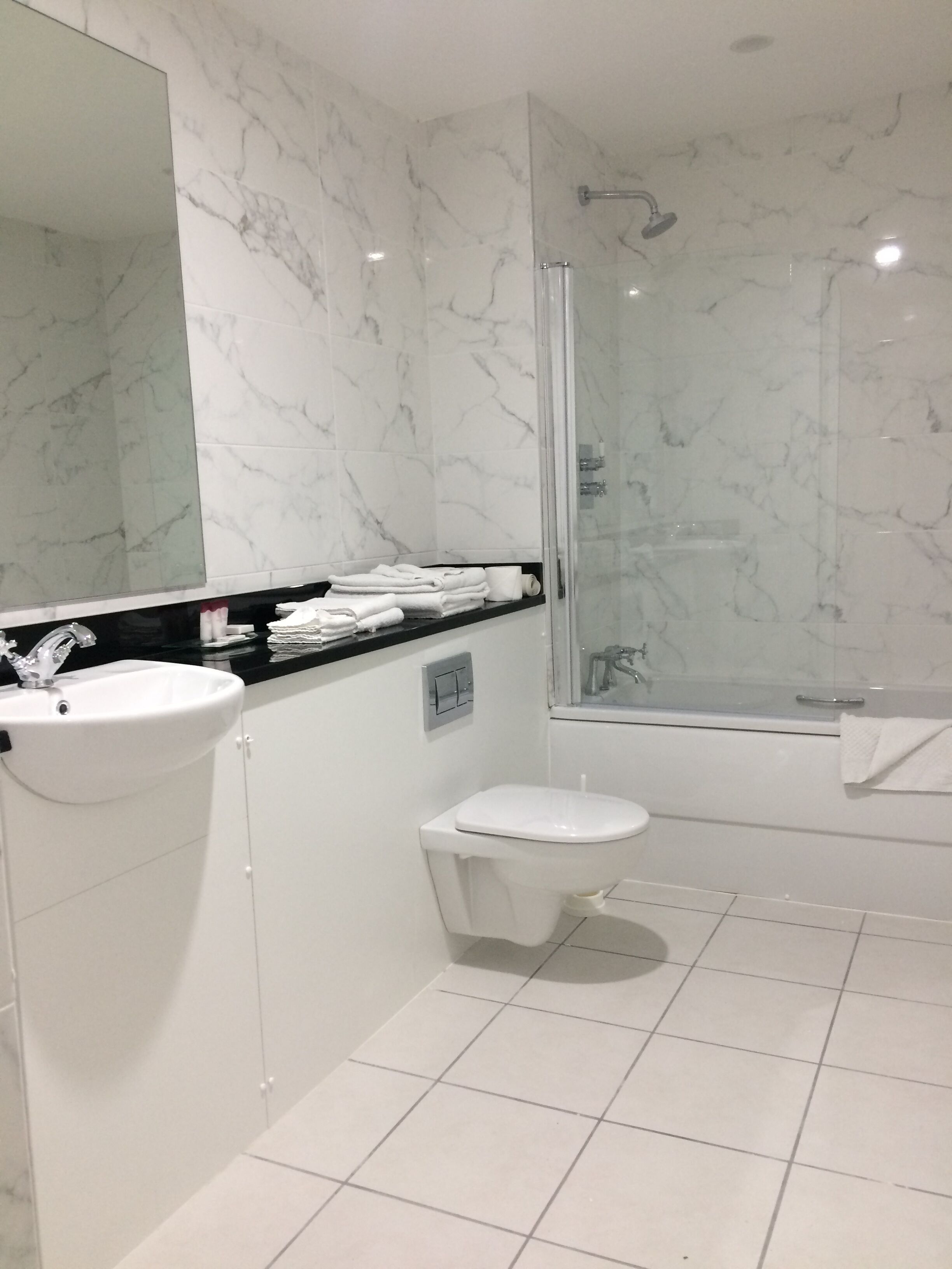 eco-friendly toiletries, hair dryer, towels