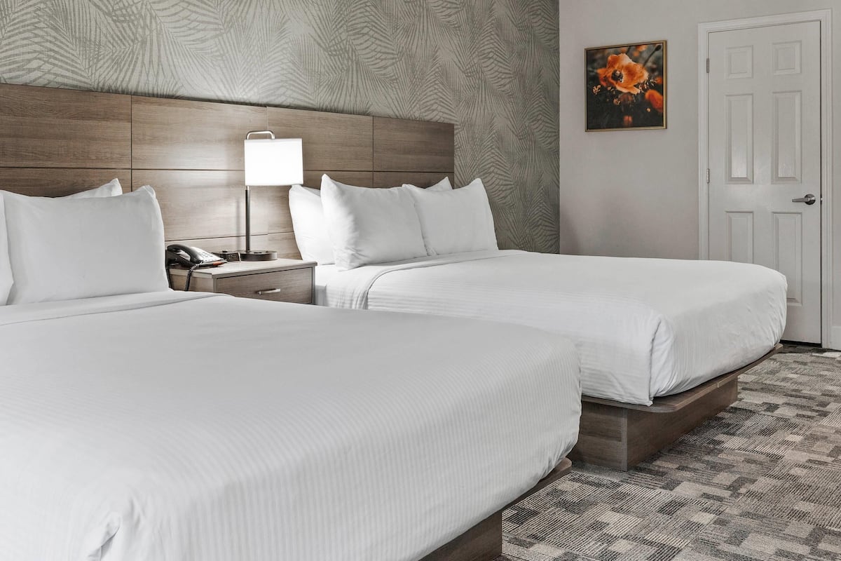 Suite, Multiple Beds, Non Smoking | Down duvets, desk, laptop workspace, iron/ironing board