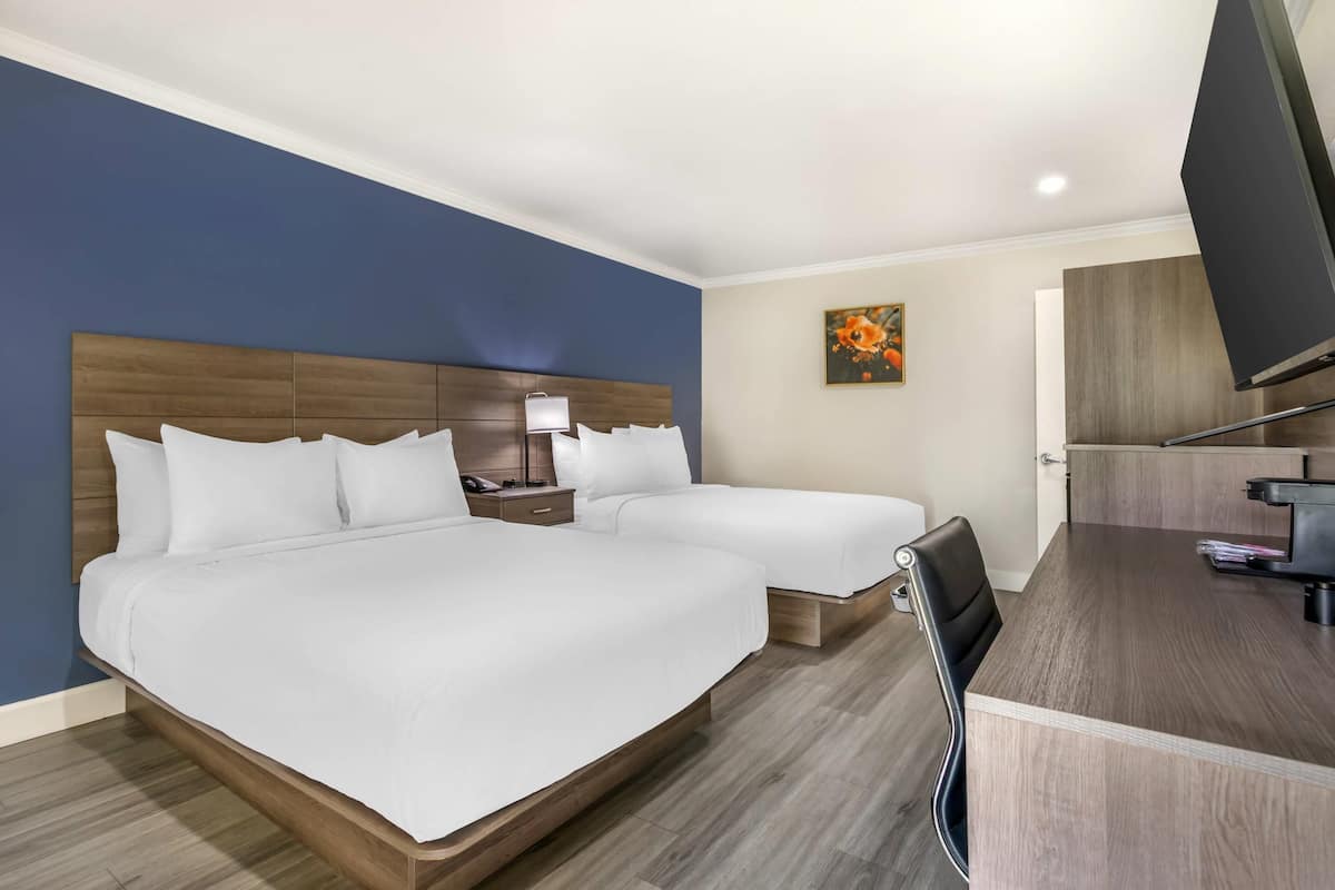 Standard Room, 2 Queen Beds, Non Smoking | Down comforters, desk, laptop workspace, iron/ironing board