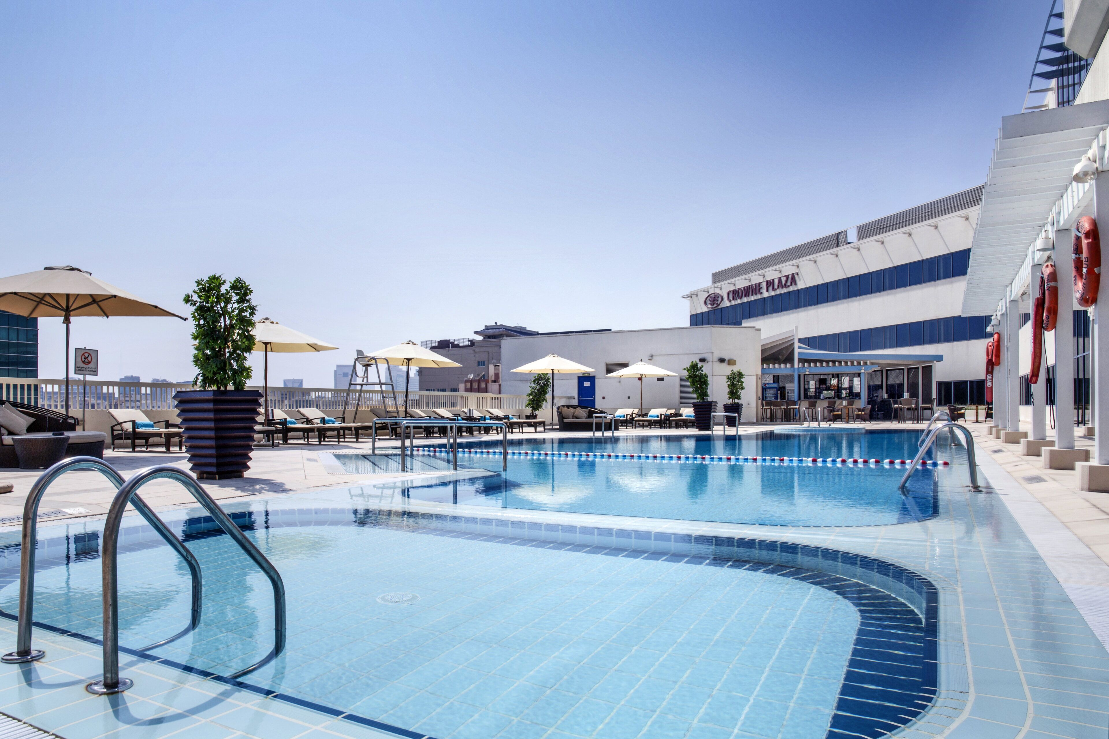 outdoor pool, open 7:00 am to 9:00 pm, pool umbrellas, pool loungers