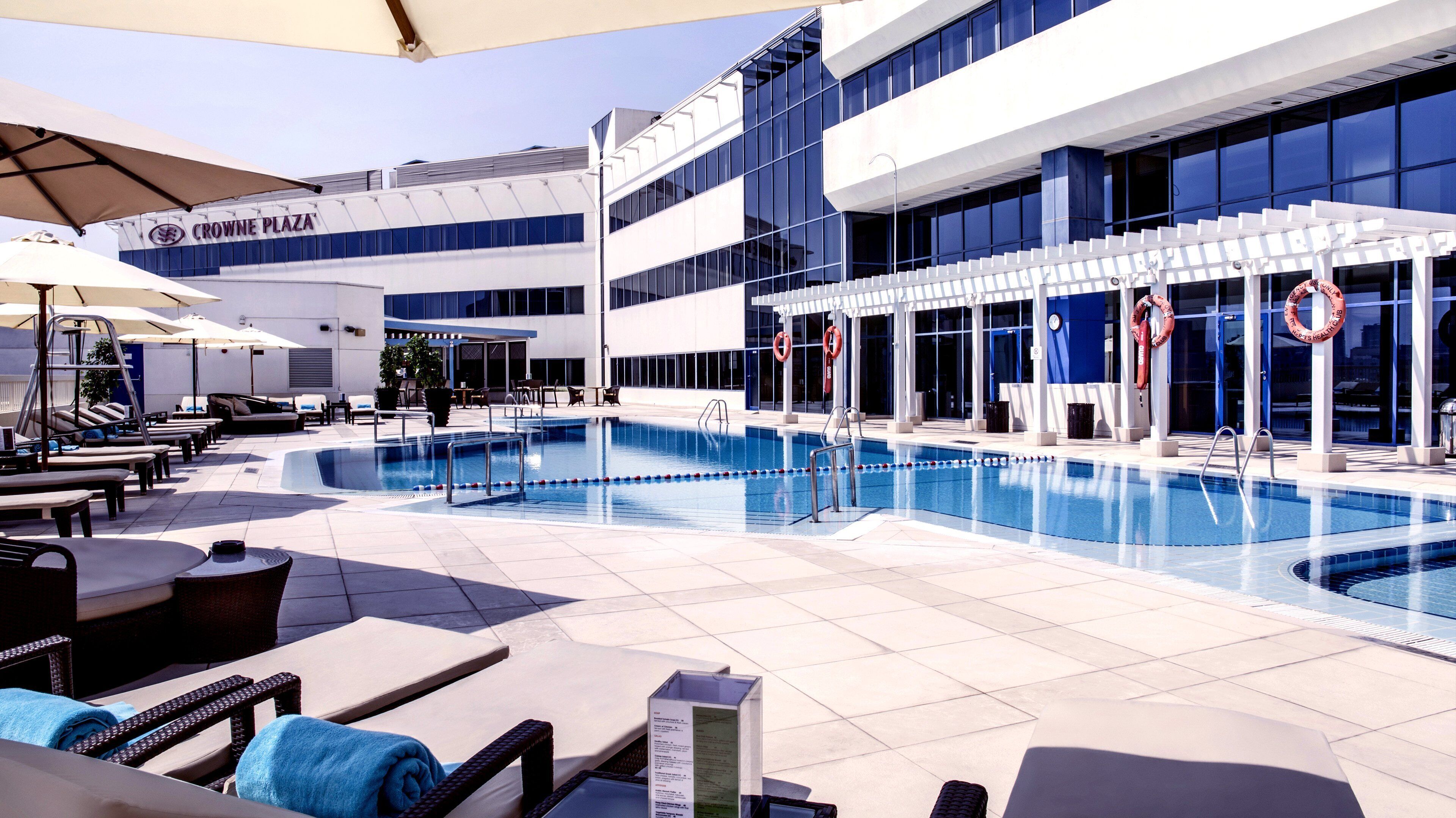 Outdoor pool, open 7:00 AM to 9:00 PM, pool umbrellas, pool loungers
