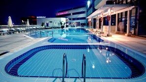 Outdoor pool, open 7:00 AM to 9:00 PM, pool umbrellas, sun loungers