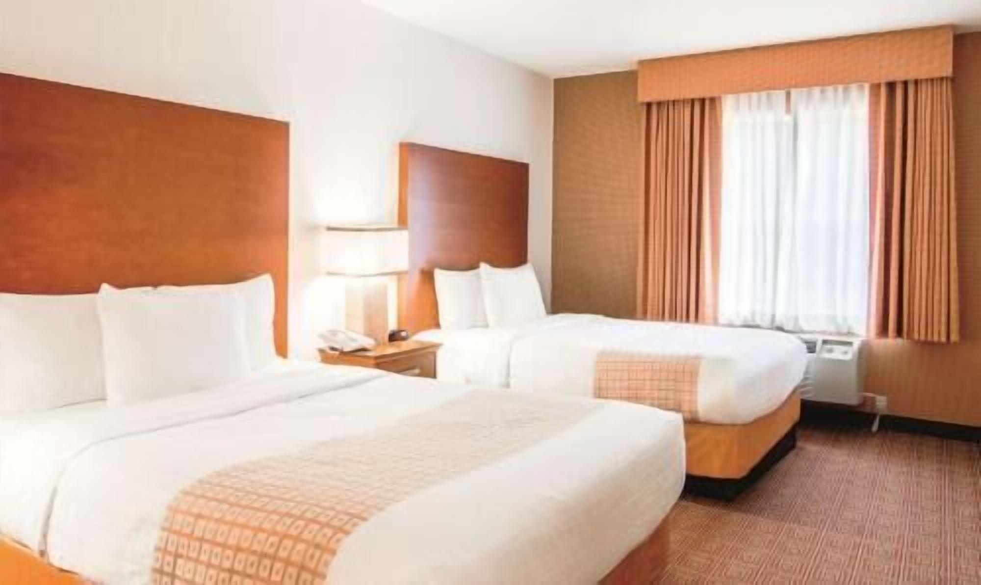 Premium bedding, pillowtop beds, desk, laptop workspace