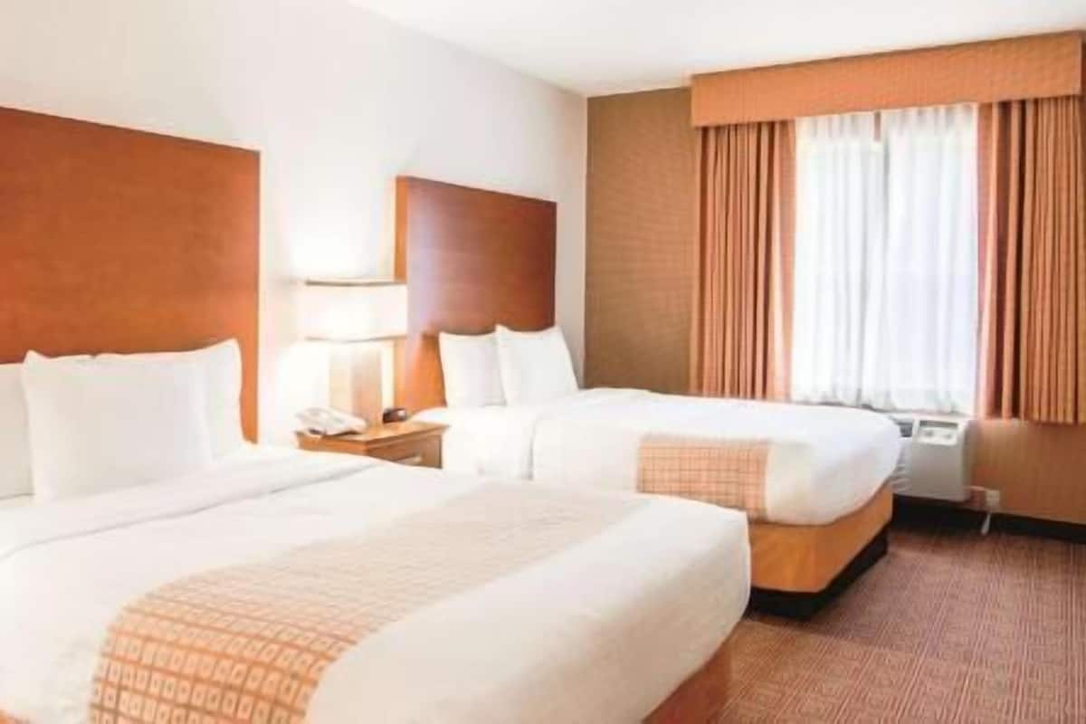 Premium bedding, pillowtop beds, desk, laptop workspace