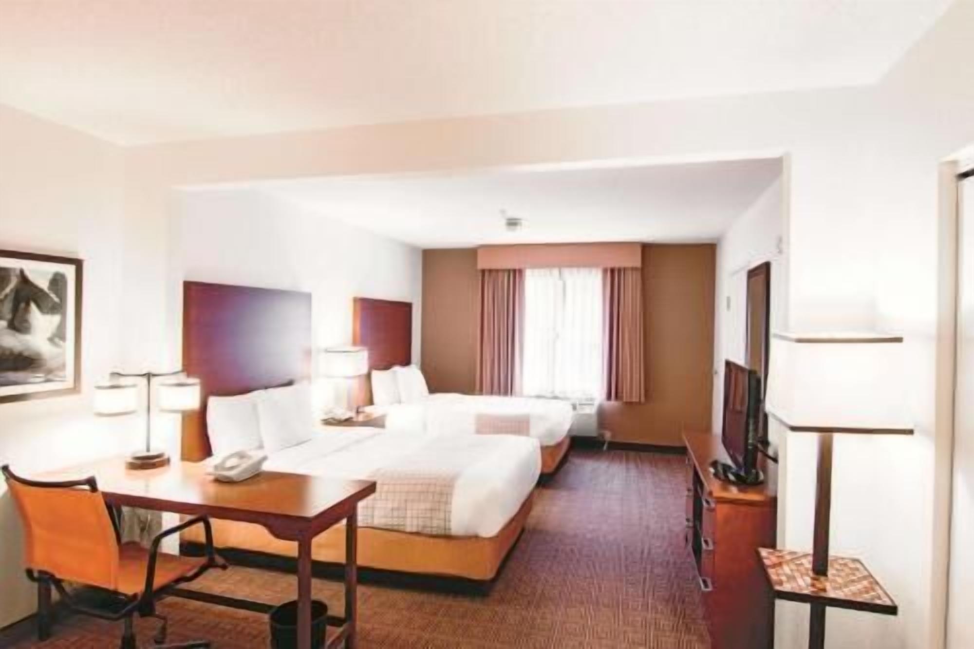 Premium bedding, pillowtop beds, desk, laptop workspace