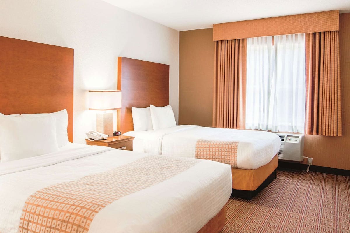 Premium bedding, pillowtop beds, desk, laptop workspace