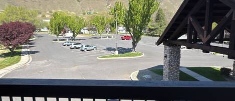 A parking lot with a view of a mountain range.