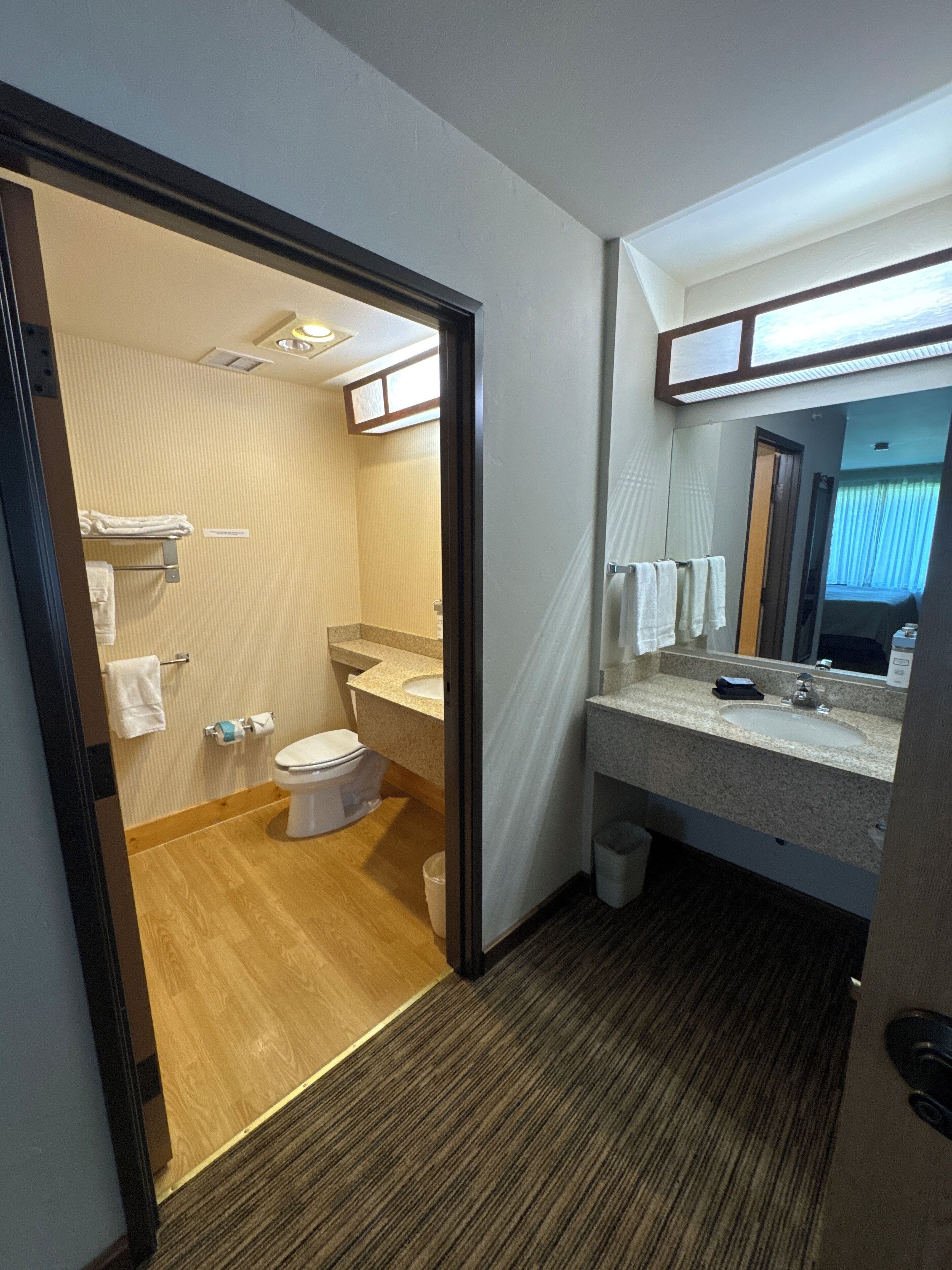 parking lot suite | bathroom | combined shower/bathtub, free toiletries, hair dryer, towels