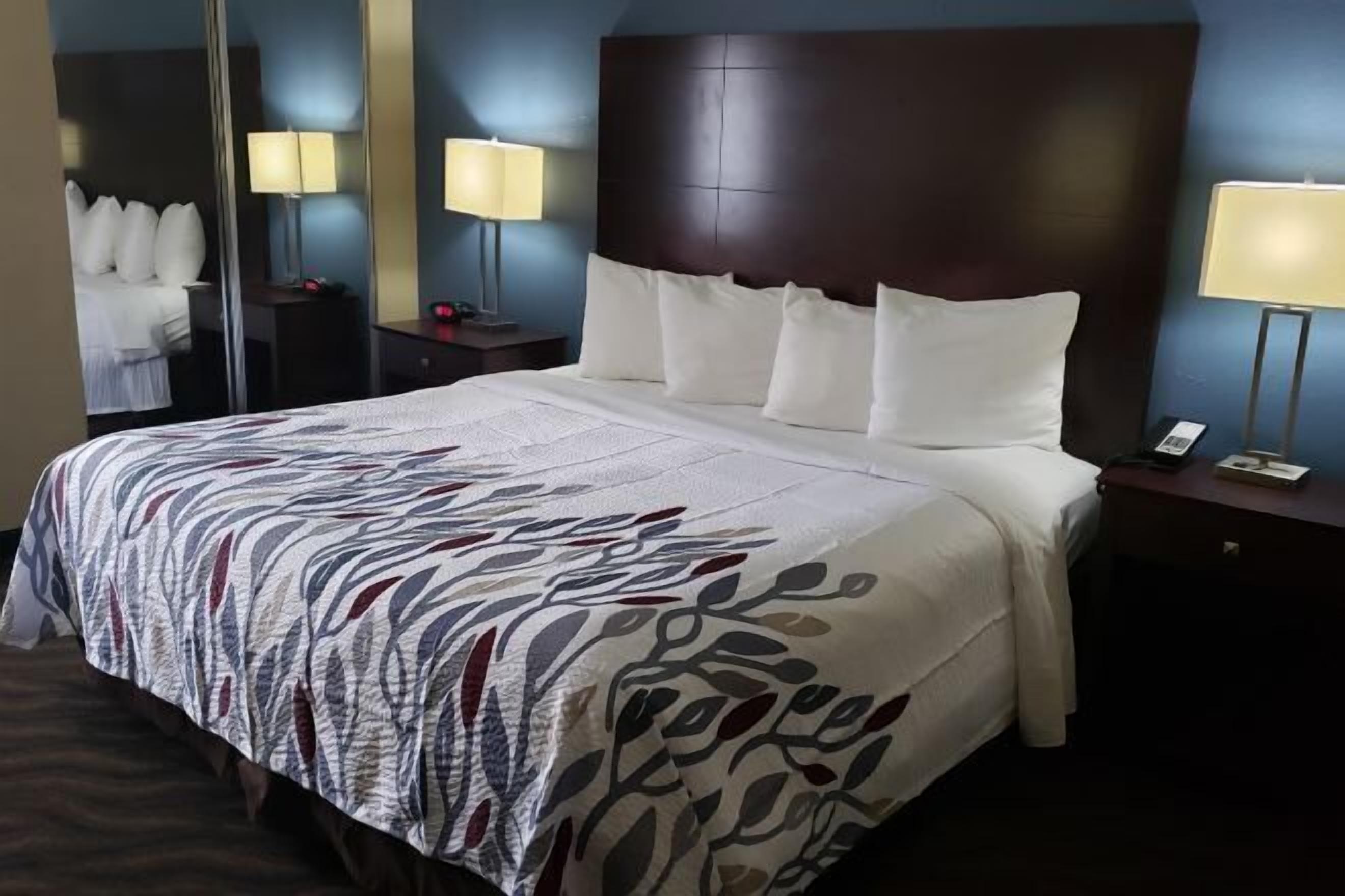 Desk, laptop workspace, blackout drapes, iron/ironing board