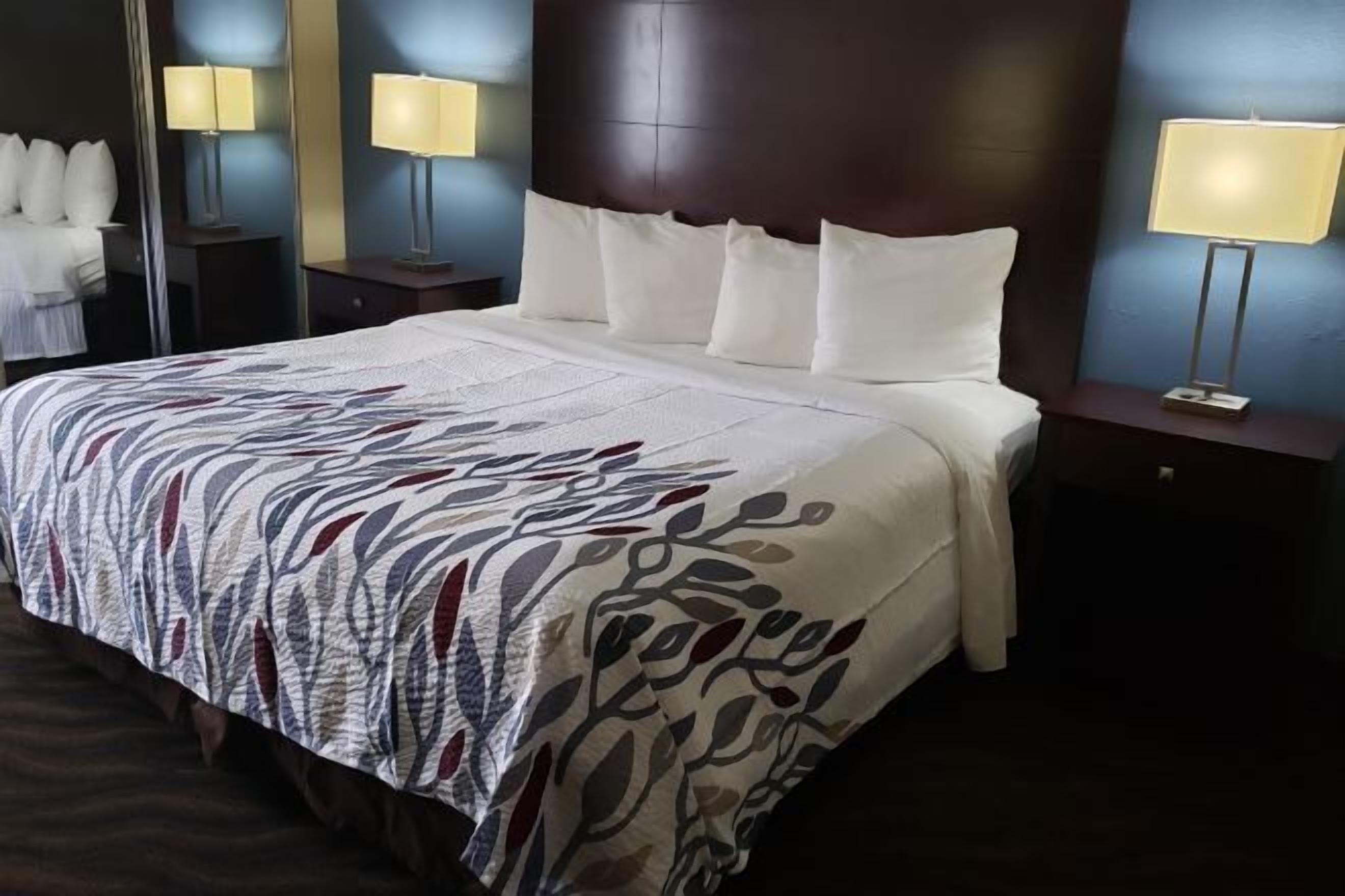 Desk, laptop workspace, blackout drapes, iron/ironing board