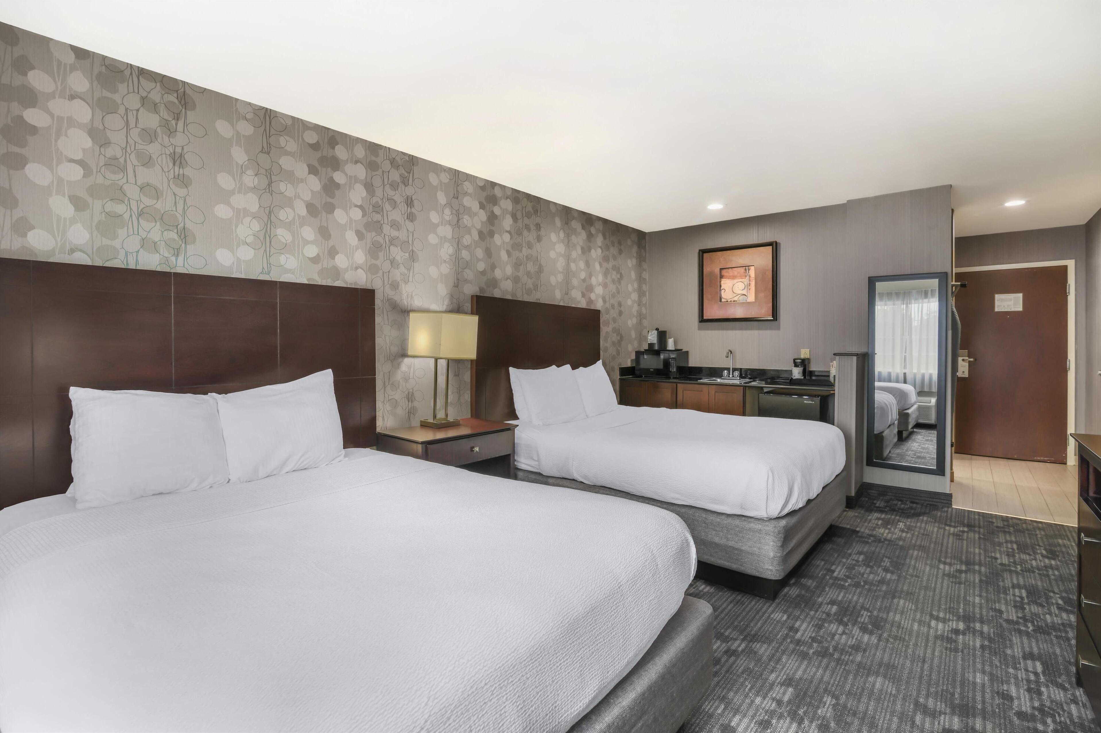 standard room, 2 queen beds, non smoking, refrigerator & microwave | in-room safe, blackout curtains, iron/ironing board