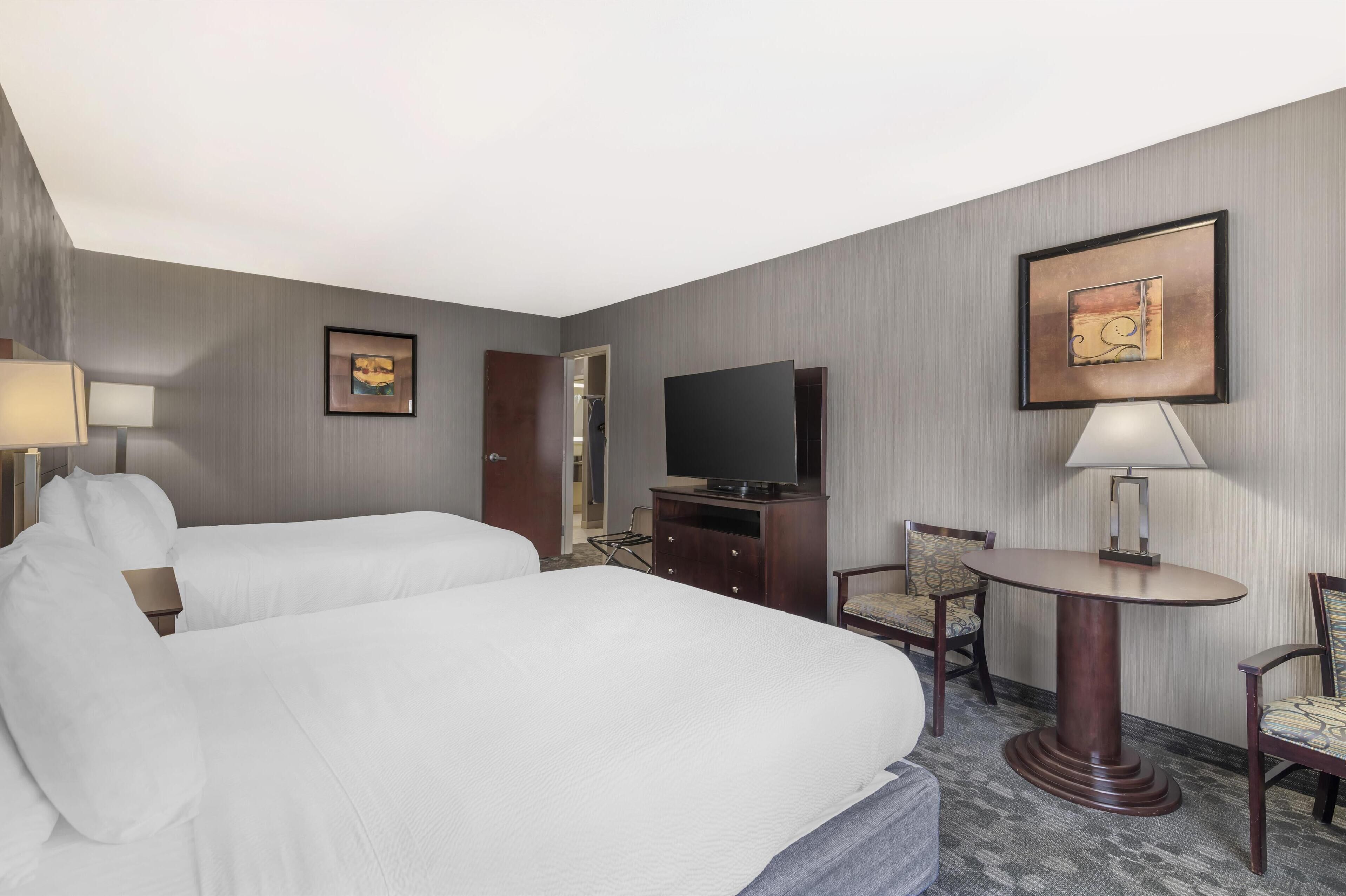 suite, 2 queen beds, non smoking, refrigerator & microwave (living room;with sofabed) | in-room safe, blackout curtains, iron/ironing board