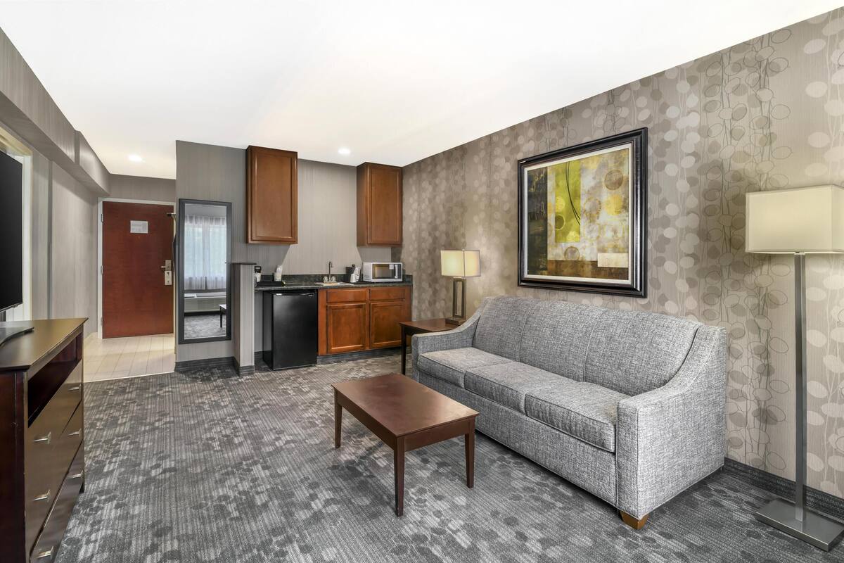 suite, 2 queen beds, non smoking, refrigerator & microwave (living room;with sofabed) | in-room safe, blackout curtains, iron/ironing board