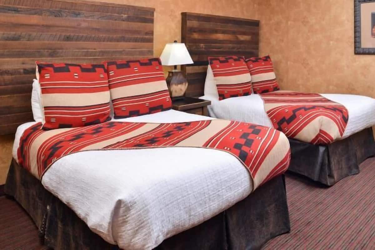 Desk, laptop workspace, blackout drapes, iron/ironing board