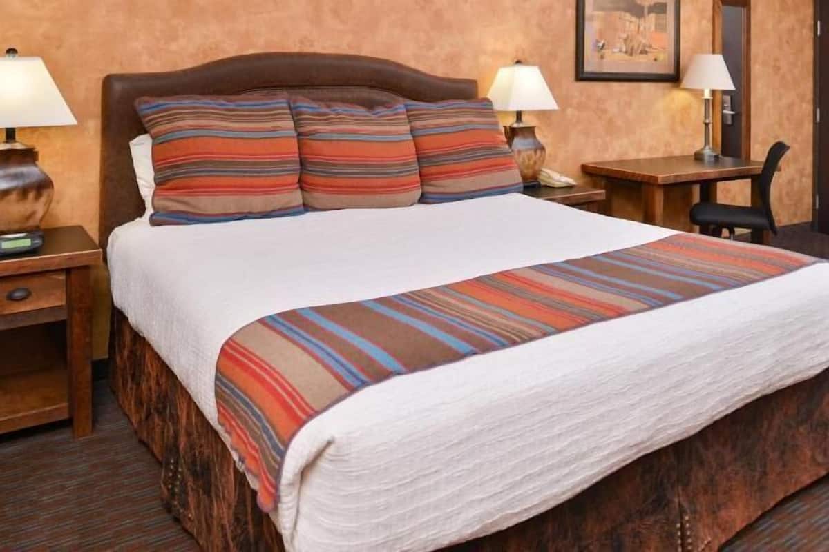 Desk, laptop workspace, blackout drapes, iron/ironing board