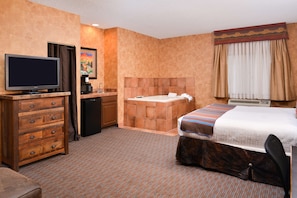 Suite, 1 King Bed, Non Smoking, Jetted Tub | Desk, laptop workspace, blackout curtains, iron/ironing board