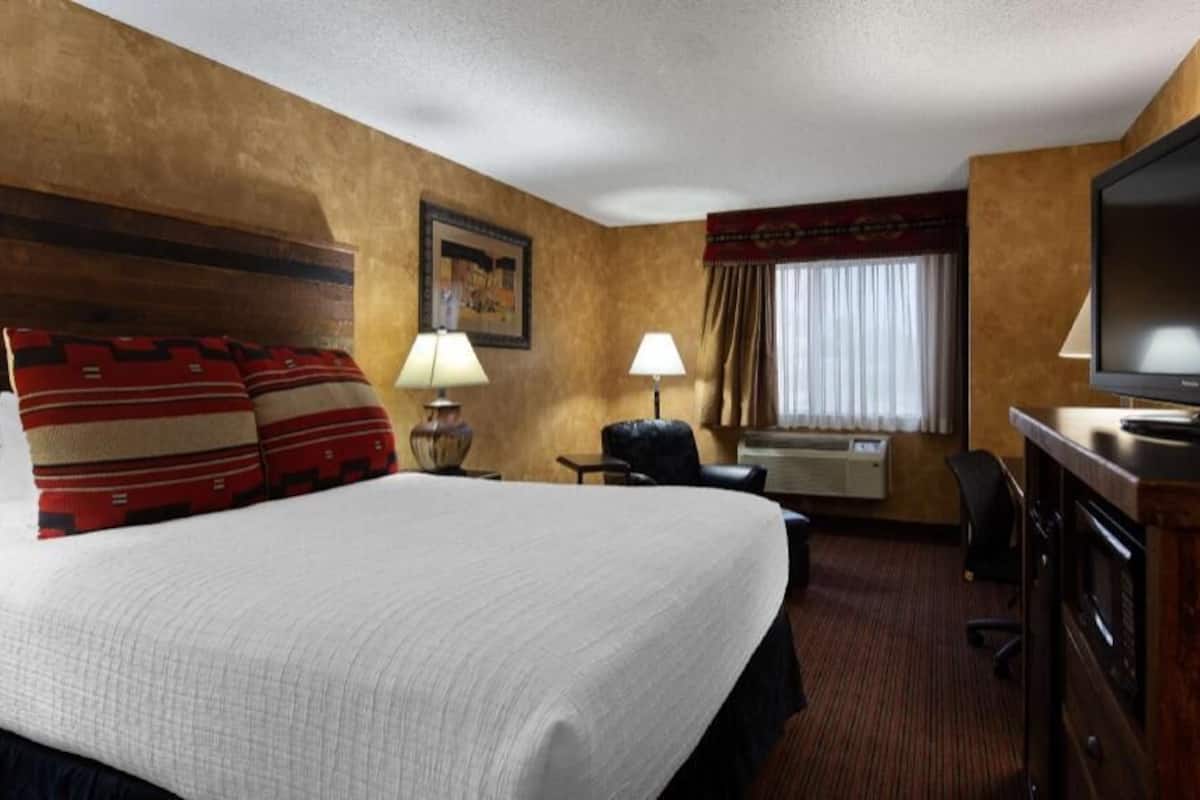 Desk, laptop workspace, blackout drapes, iron/ironing board