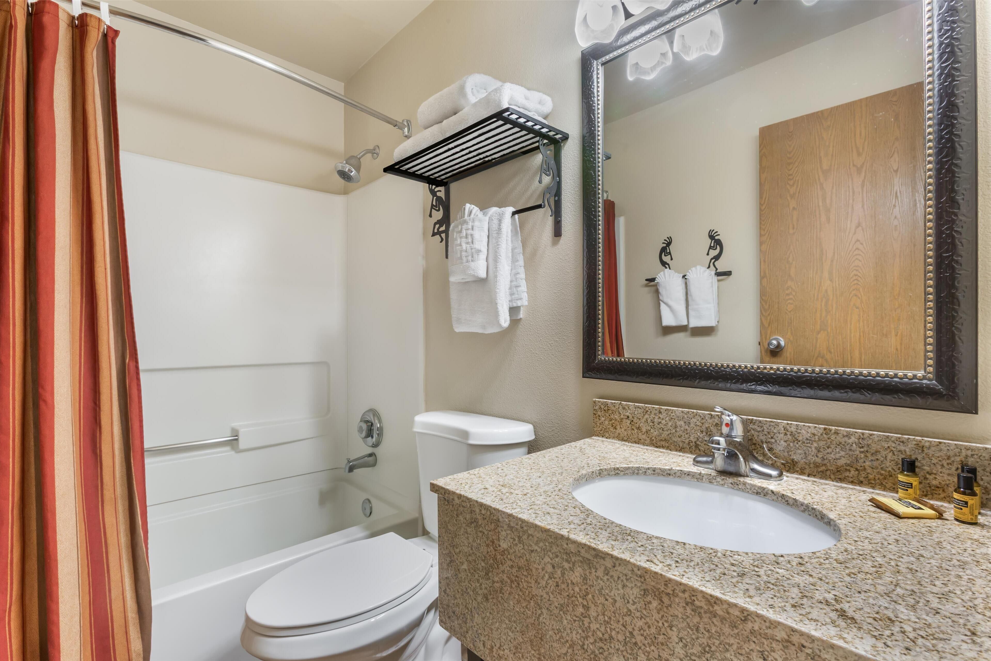 standard room, 1 king bed, non smoking, refrigerator & microwave | bathroom | combined shower/bathtub, free toiletries, hair dryer, towels