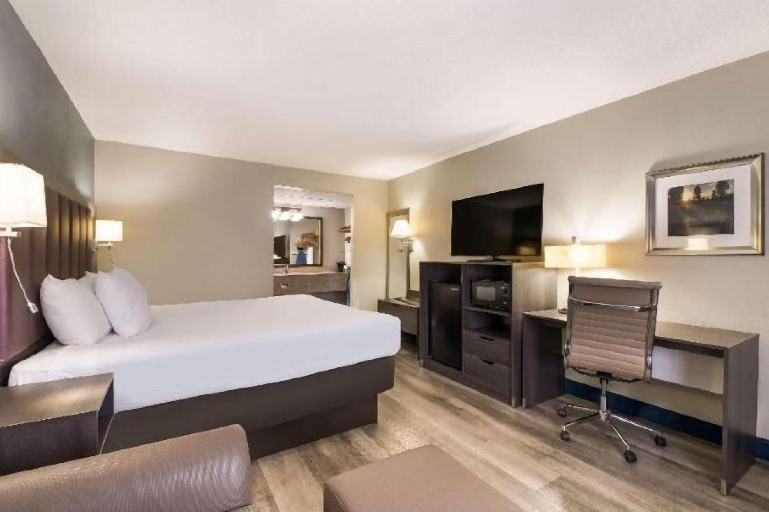 Desk, laptop workspace, blackout drapes, iron/ironing board