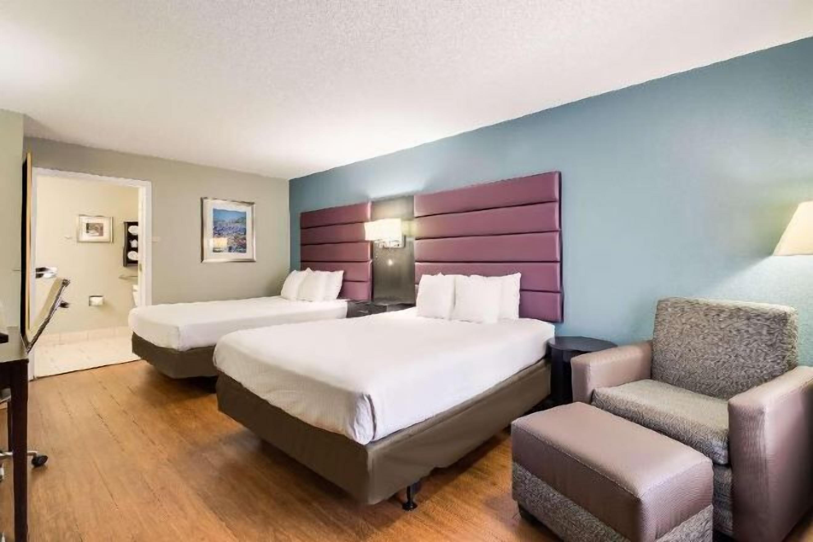 Desk, laptop workspace, blackout drapes, iron/ironing board