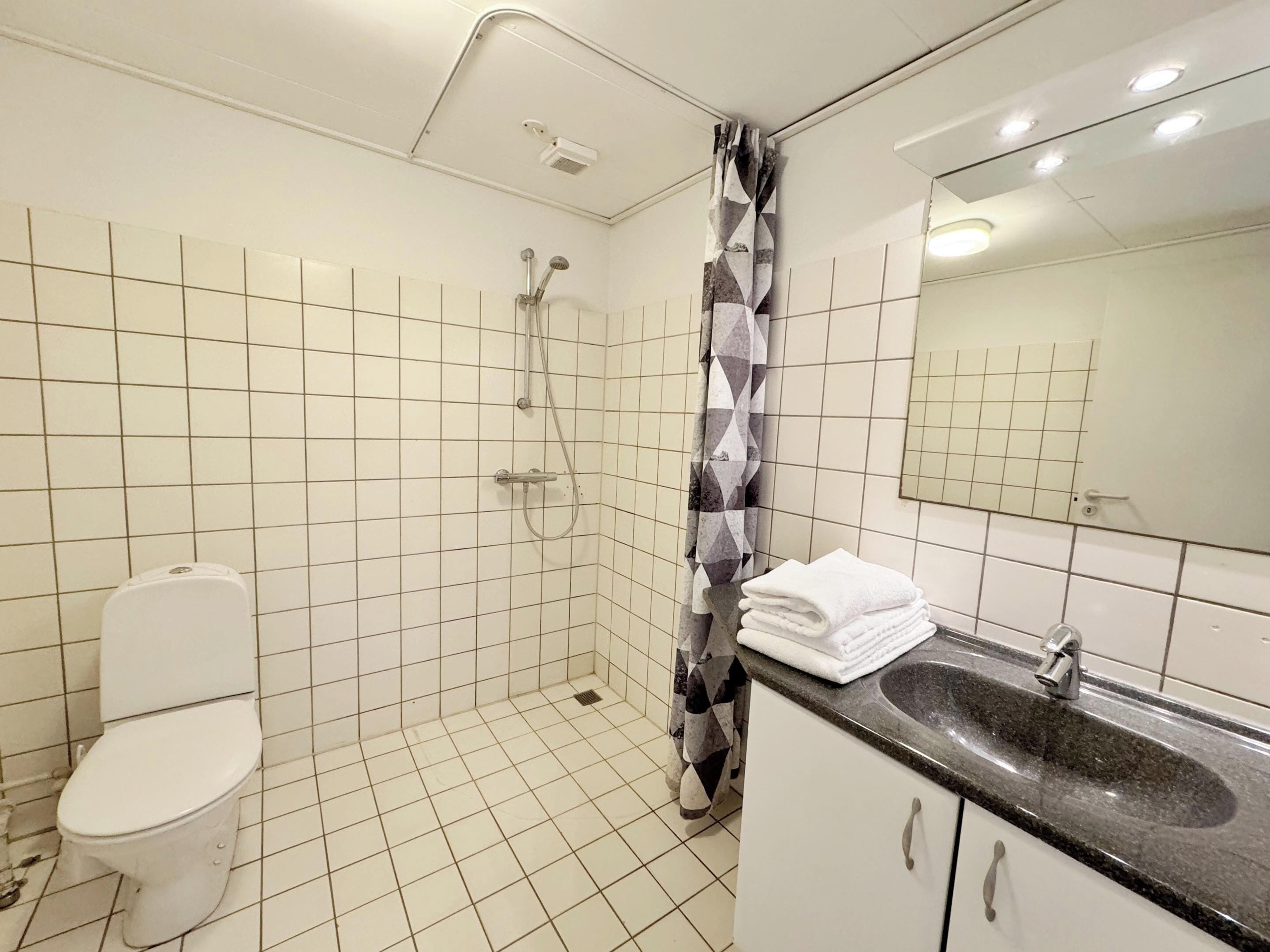 family room | bathroom | shower, free toiletries, hair dryer, slippers