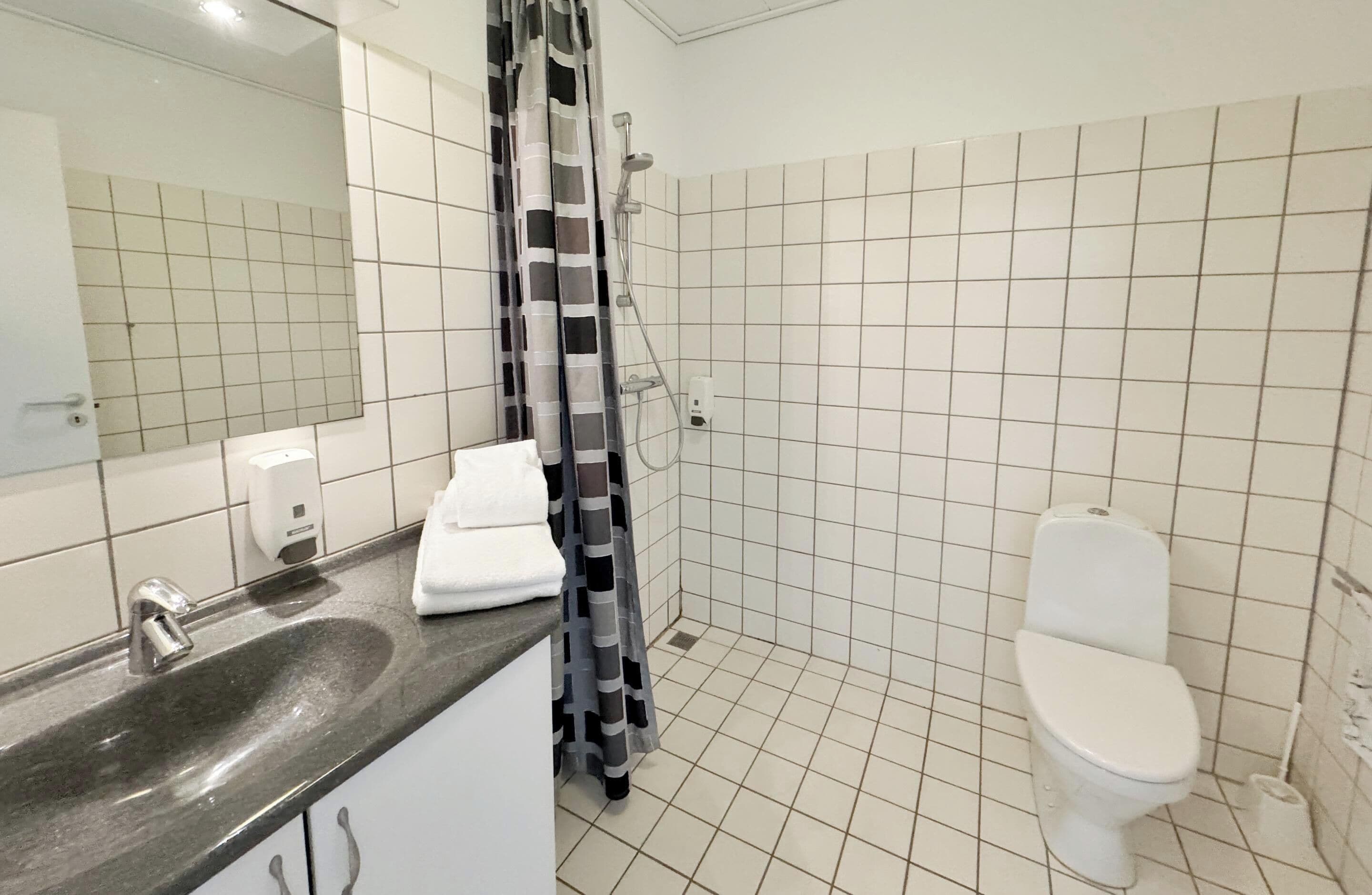 standard room | bathroom | shower, free toiletries, hair dryer, slippers