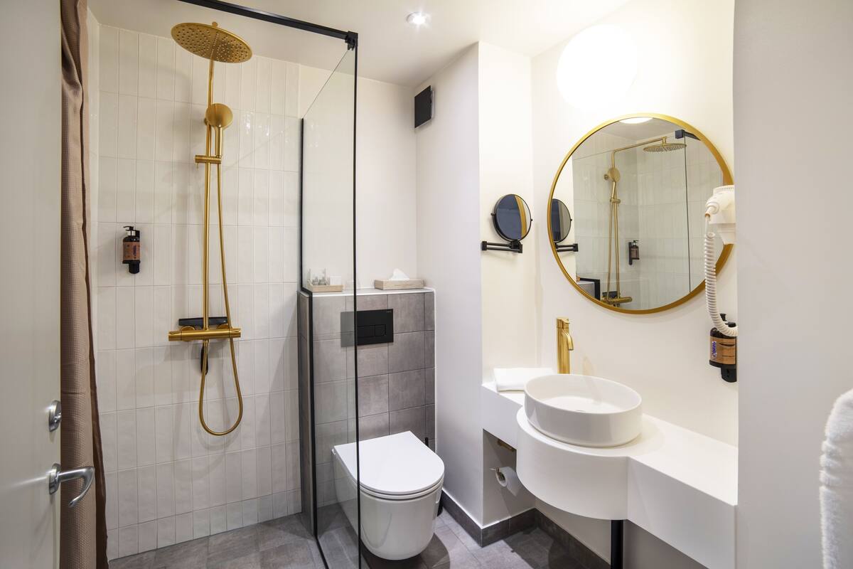 large family room | bathroom | shower, hair dryer, towels, soap