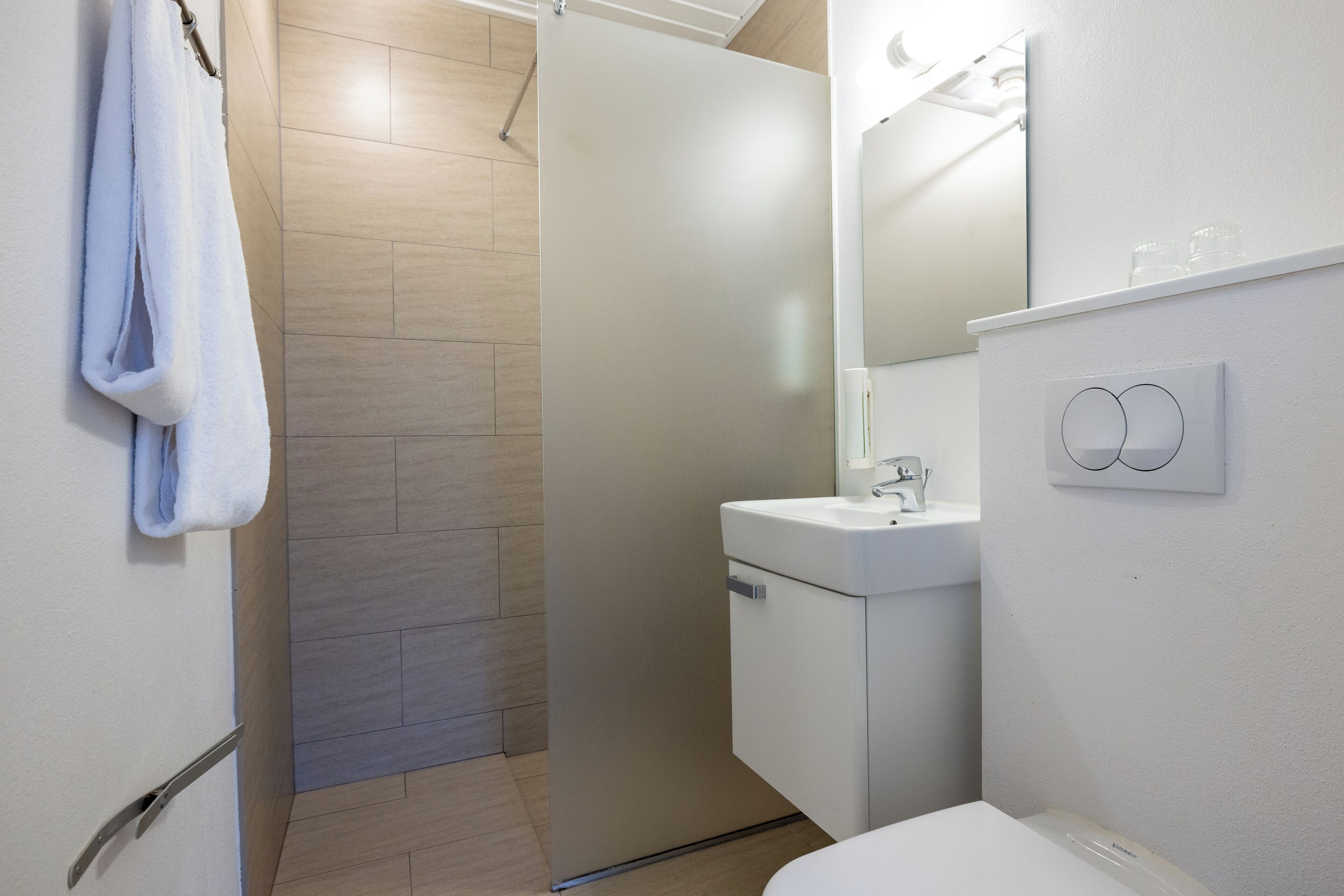 standard room | bathroom | shower, hair dryer, towels, soap