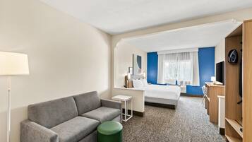 Room, 1 King Bed with Sofa bed | Living area | 50-inch TV with satellite channels, pay movies