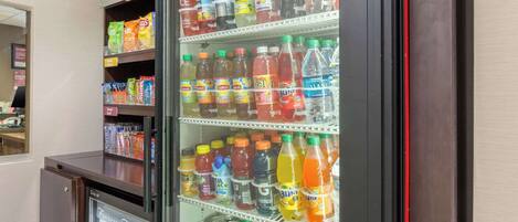 A vending machine stocked with various beverages and snacks.