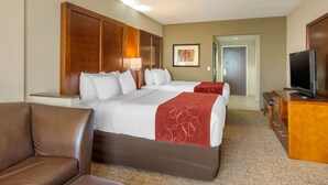 A hotel room with a large bed, a TV, a desk, and a chair. - Comfort Suites South Park (Colonial Heights)