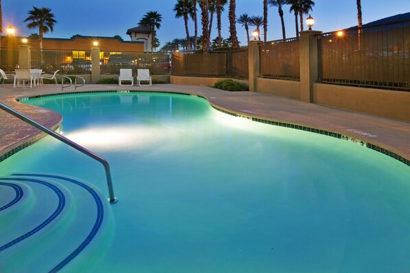 Outdoor pool, open 7:00 AM to 10:00 PM, pool loungers
