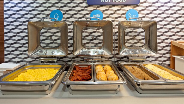 A buffet with various food options including scrambled eggs, bacon, and pastries. - Holiday Inn Express & Suites Rancho Mirage - Palm Spgs Area by IHG (Rancho Mirage)