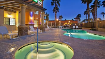 Outdoor pool, open 7:00 AM to 10:00 PM, pool loungers