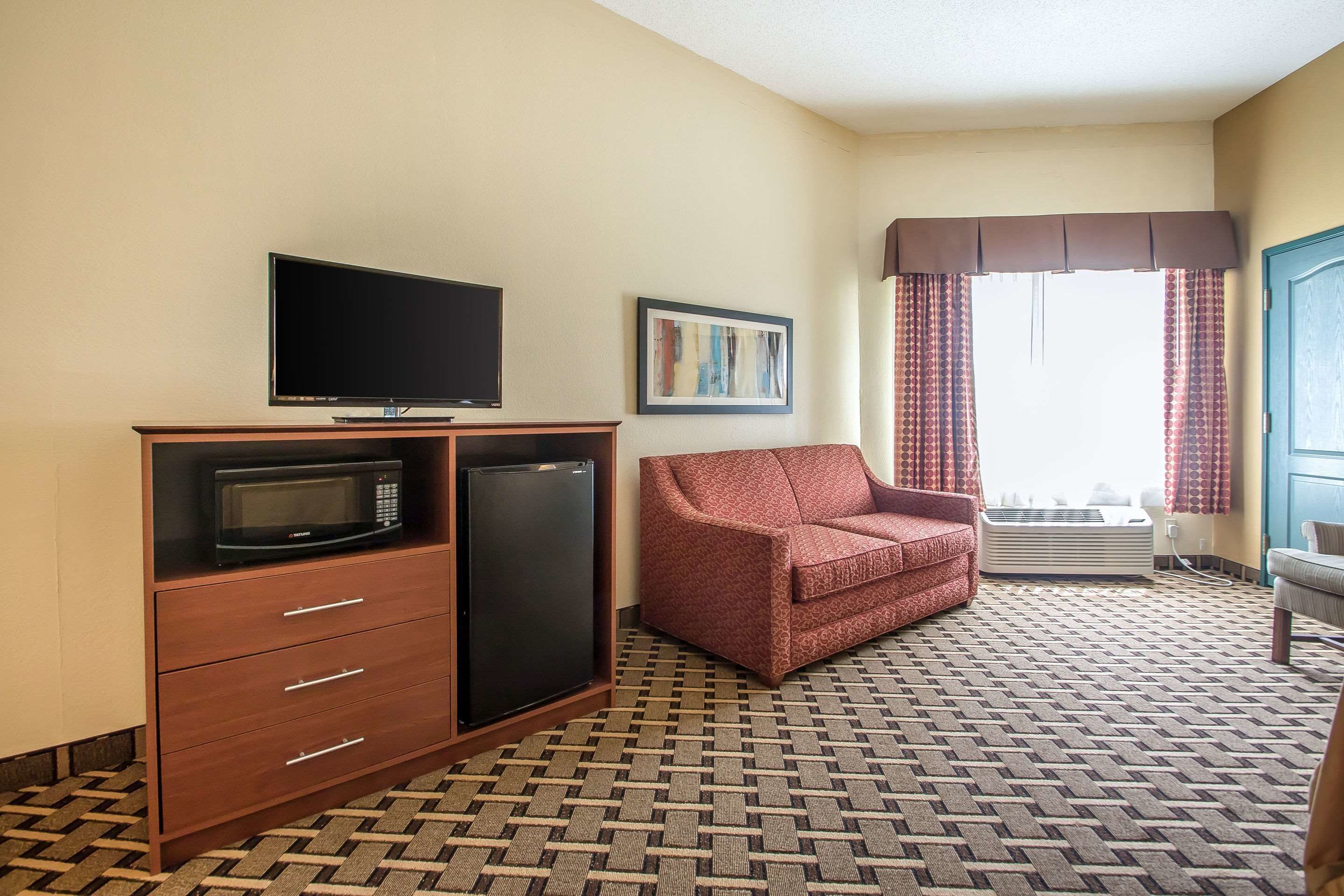 suite, 1 king bed with sofa bed, non smoking, jetted tub | desk, iron/ironing board, cots/infant beds, rollaway beds