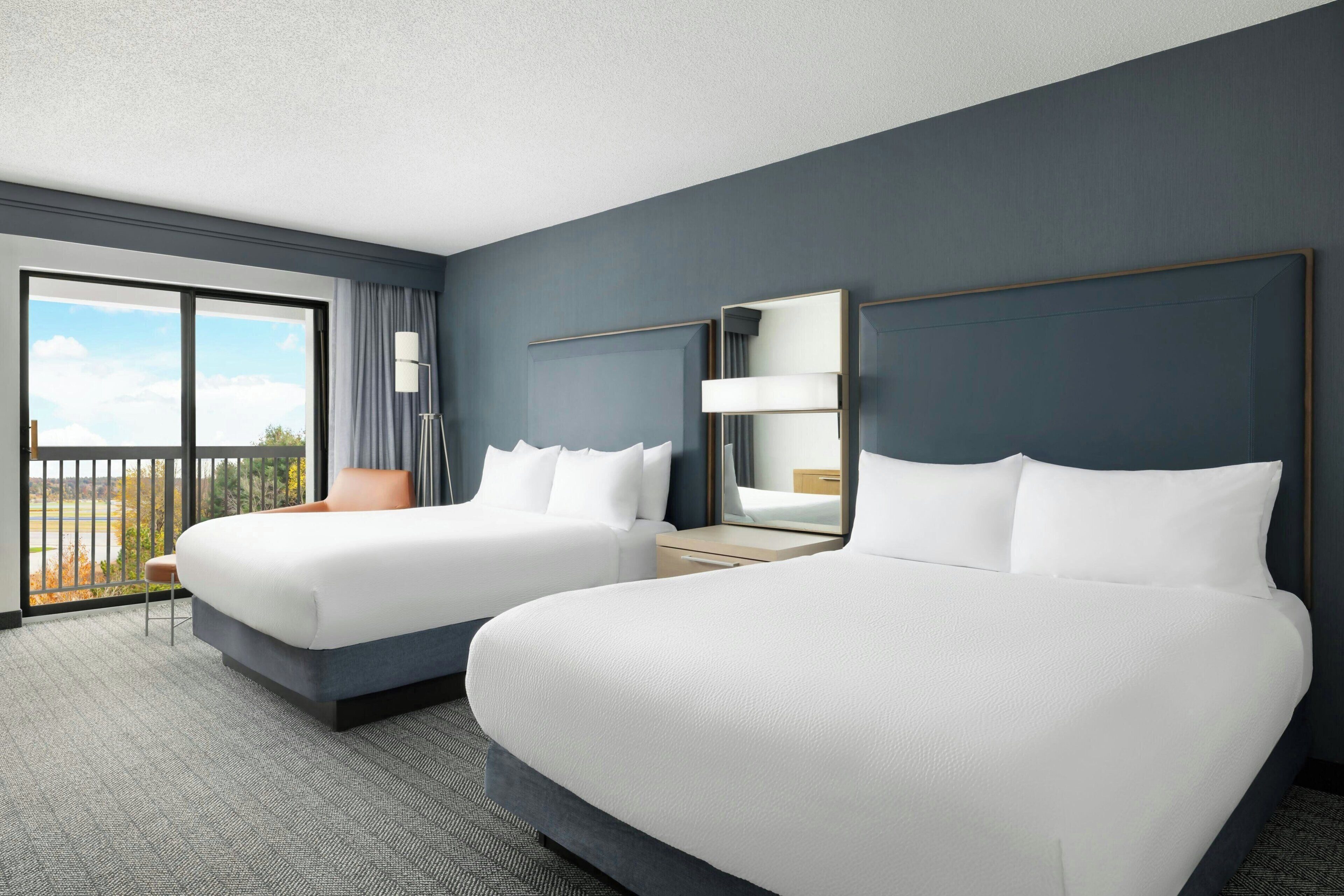 Premium bedding, down comforters, desk, laptop workspace