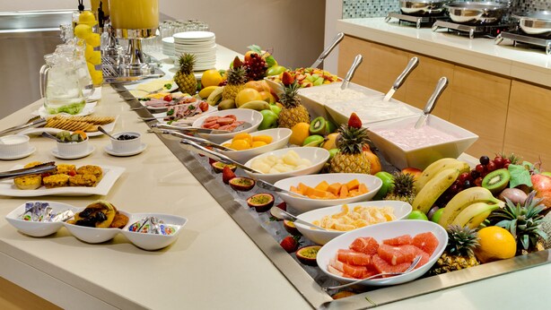 A buffet with various fruits, vegetables, and a variety of dishes. - ANEW Hotel Roodepoort Johannesburg (Roodepoort)