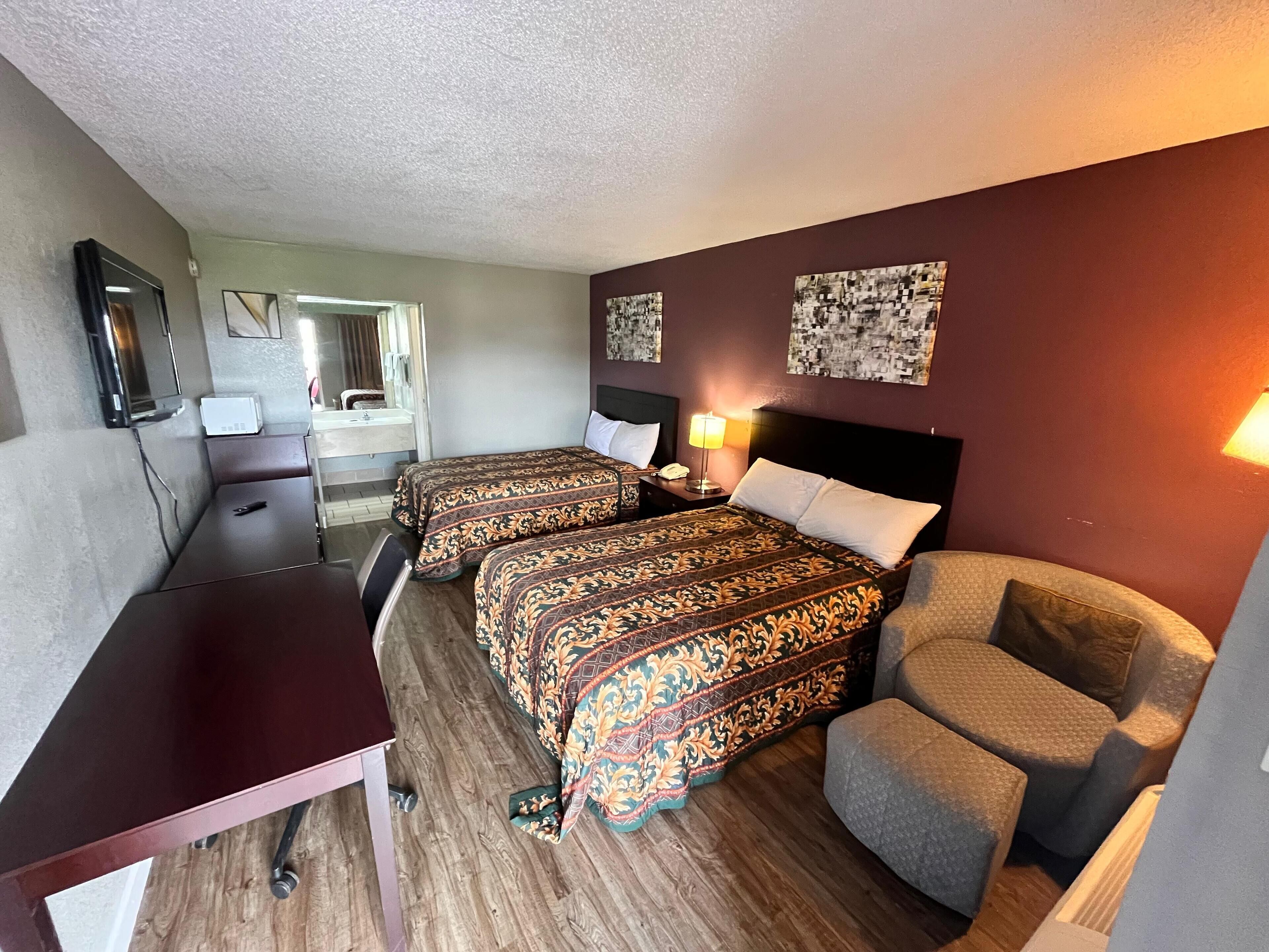 Desk, laptop workspace, blackout drapes, iron/ironing board