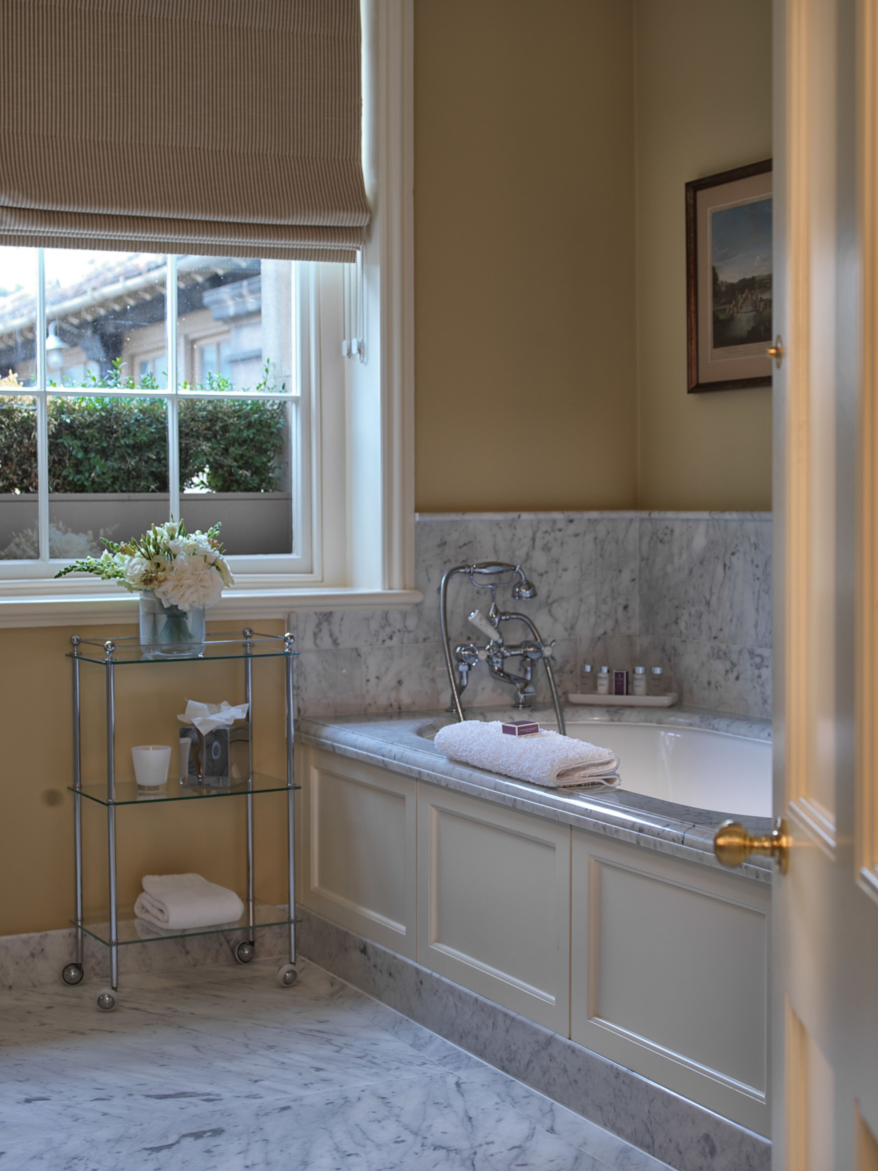 designer toiletries, hair dryer, bathrobes, slippers