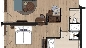 A hotel room layout with a bed, seating area, and a bathroom.